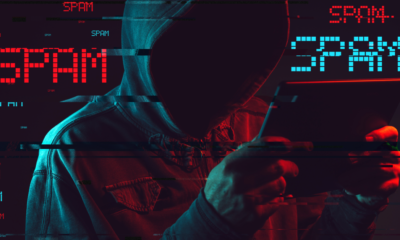 Electronic spamming concept with faceless hooded male person